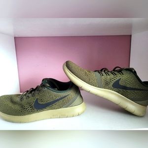 Nike Free size 9 women dark green like new.
